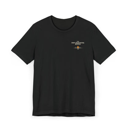 First Responder Bond T-ShirtTHE FIRST RESPONDER BOND  They don’t call it family. But it feels like one.  It’s formed in sirens and silence, in blood on gloves and eyes that say, I’ve got you. It’s...